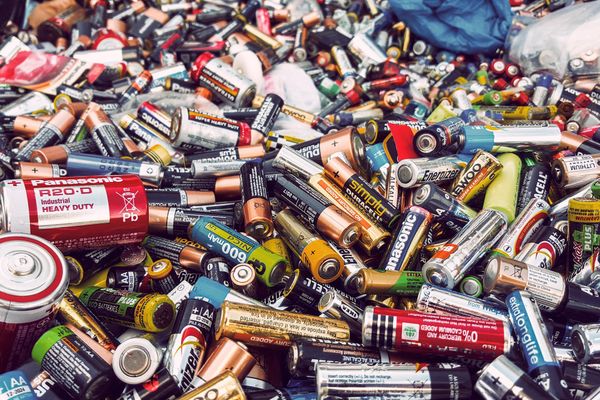 lithium-ion batteries waste pile in landfill